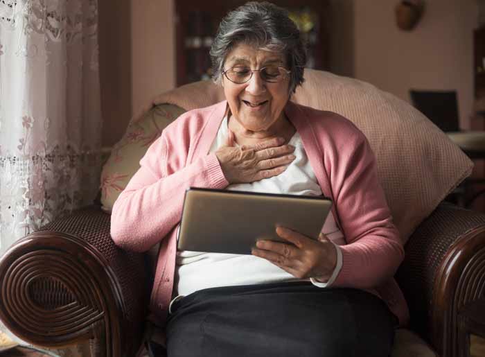 senior-woman-at-home-tablet